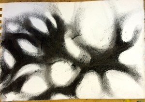 Charcoal drawing of moving shadows. The negative spaces are light holes between the leaves...